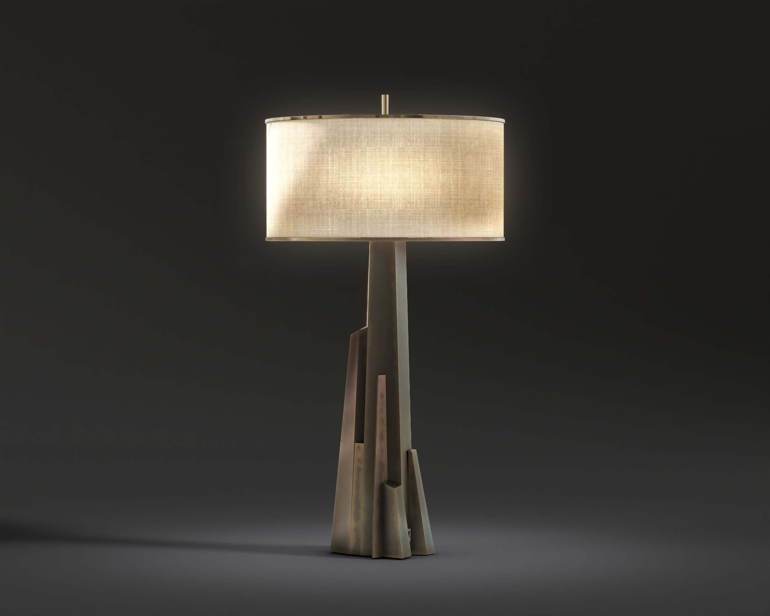 Meta crystal table lamp patina bronze casting body linen shade black background perspective shot