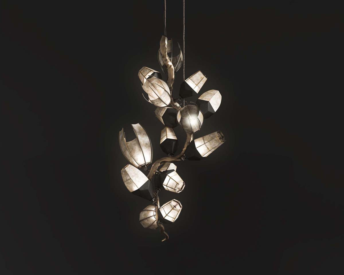 Venomous Vertical Chandelier in goatskin and black matte globe, patina bronze frame black background front shot