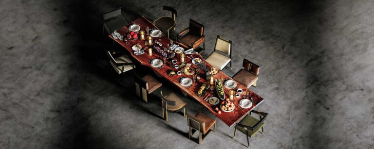 different chairs with a live edge table top in a black studio from top angle