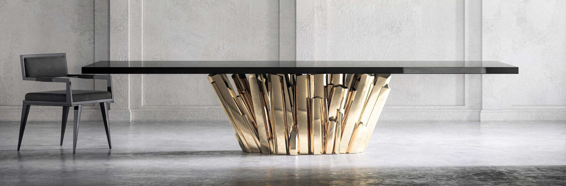 Polished bronze Meta Crystal dining table with a Le Loup Dining Chair beside it