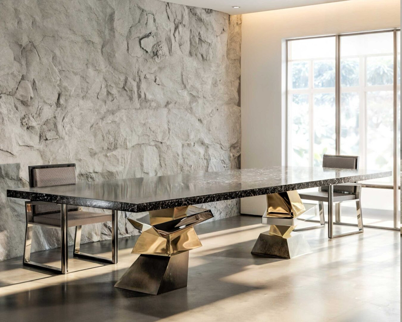 Roche Dining Table and Buccina Dining chairs in a room with a stone wall