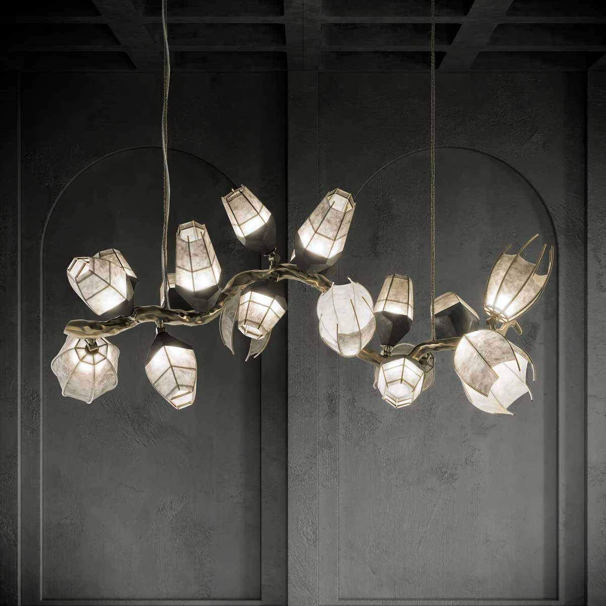 Venomous horizontal Chandelier in a black studio front shot