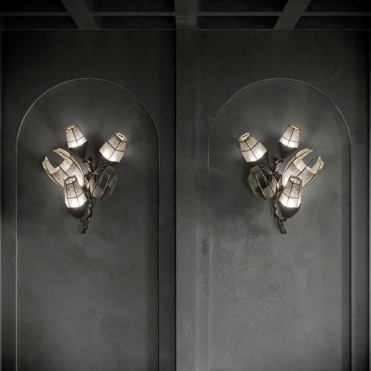 Venomous sconces in a black studio front shot